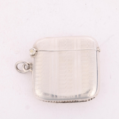 253 - An Edwardian silver Vesta case, Joseph Gloster Ltd, Birmingham 1902, curved square form with allover... 