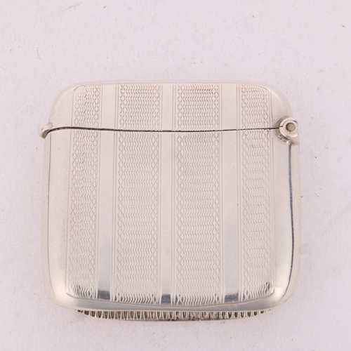 254 - An Edwardian silver Vesta case, Henry Charles Freeman, Birmingham 1904, curved square form with allo... 