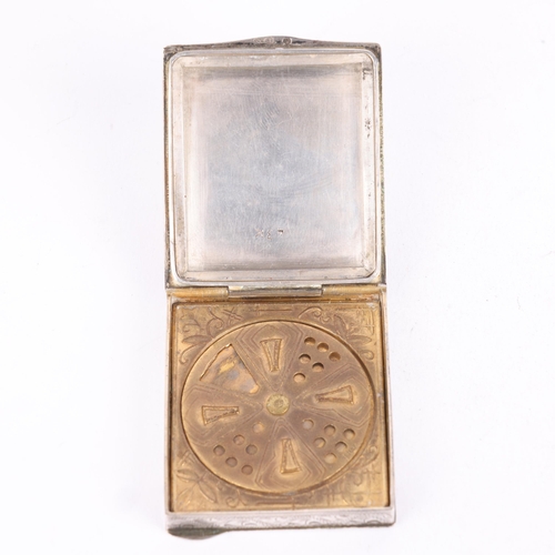 265 - A Continental silver powder compact, rectangular form with allover engraved foliate decoration and b... 