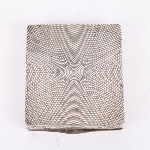 265 - A Continental silver powder compact, rectangular form with allover engraved foliate decoration and b... 