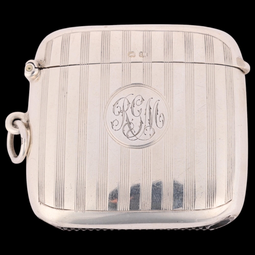 267 - A George V silver Vesta case, Charles S Green & Co, Birmingham 1919, curved rectangular form with al... 