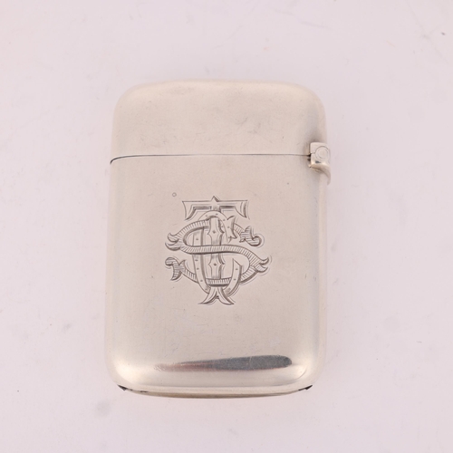 37 - SAMPSON MORDAN & CO - a Victorian silver 'Armorial' Vesta case, London 1891, rounded rectangular for... 