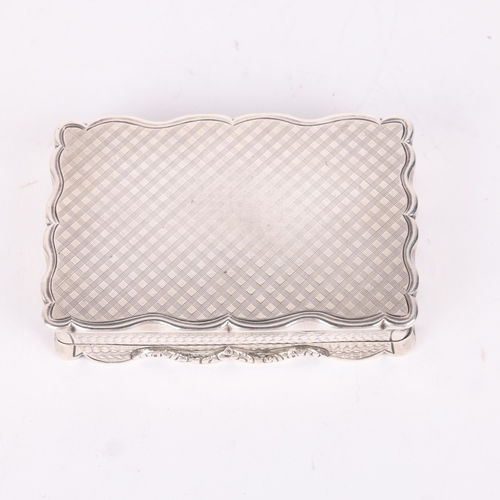 44 - NATHANIEL MILLS - an early Victorian silver snuff box, Birmingham 1844, shaped rectangular form with... 