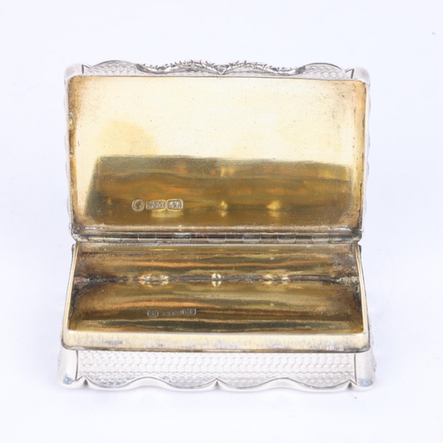 44 - NATHANIEL MILLS - an early Victorian silver snuff box, Birmingham 1844, shaped rectangular form with... 