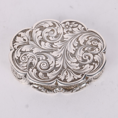 49 - NATHANIEL MILLS - an early Victorian silver vinaigrette, Birmingham 1847, shaped oval form with allo... 