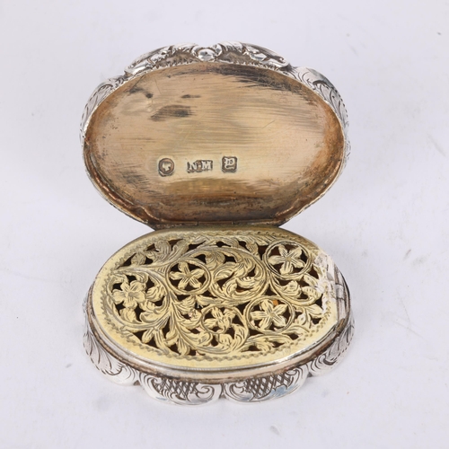 49 - NATHANIEL MILLS - an early Victorian silver vinaigrette, Birmingham 1847, shaped oval form with allo... 