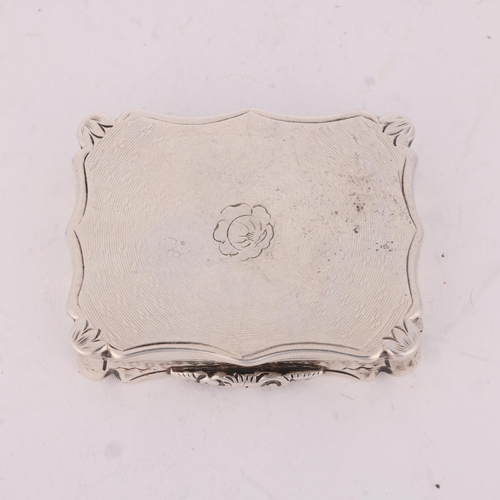 50 - NATHANIEL MILLS - an early Victorian silver vinaigrette, Birmingham 1844, shaped rectangular form wi... 