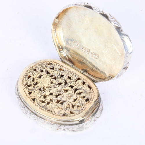 51 - NATHANIEL MILLS - an early Victorian silver vinaigrette, Birmingham 1843, shaped oval form with allo... 