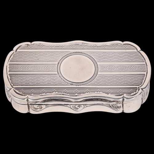 55 - A Victorian silver vinaigrette, Robert Thornton, Birmingham 1871, shaped oval form with engine turne... 