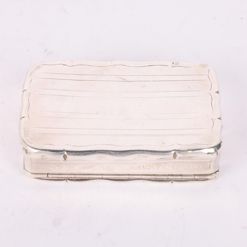 56 - A Victorian silver snuff box, Edward Smith, Birmingham 1851, shaped rectangular form with engine tur... 