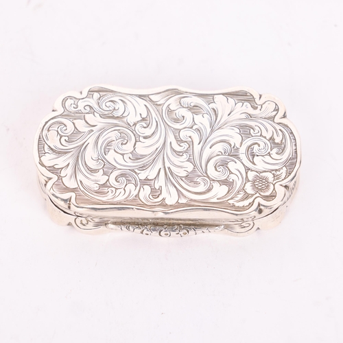 59 - A Victorian silver vinaigrette, Alfred Taylor, Birmingham 1854, shaped oval form with allover chased... 