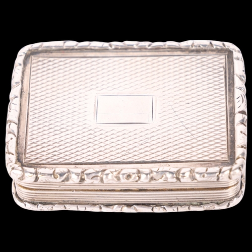 61 - A William IV silver vinaigrette, maker TS, Birmingham 1834, rectangular form with cast floral border... 