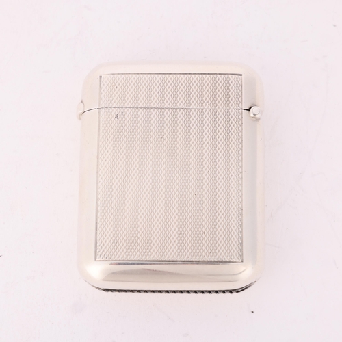 96 - A George V silver Vesta case, Alfred Clark, London 1921, rounded rectangular form with allover engin... 