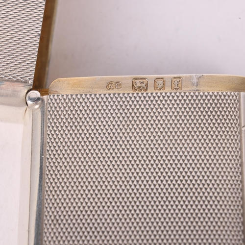 96 - A George V silver Vesta case, Alfred Clark, London 1921, rounded rectangular form with allover engin... 