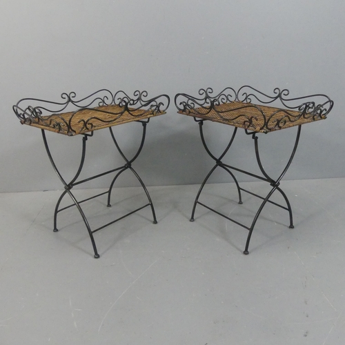 2139 - A pair of wrought iron tray tables with rattan panels and folding base. Width 59cm, height 65cm, dep... 