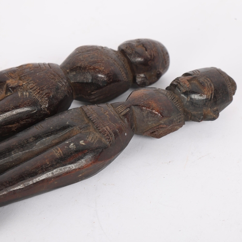 18 - 2 similar 19th century Indian carved wood dolls, largest height 20cm