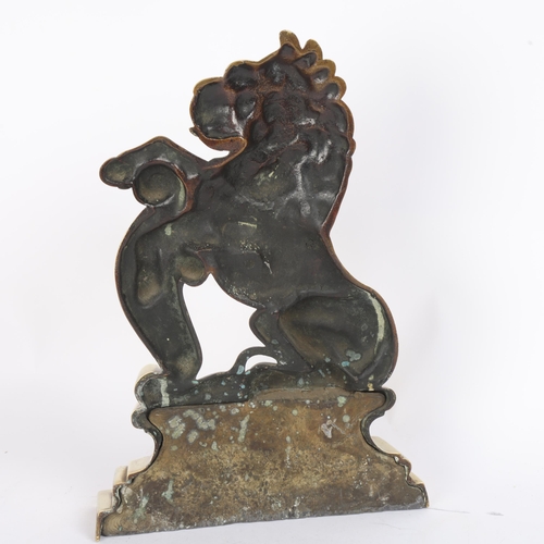 20 - A 19th century polished brass heraldic lion design doorstop, height 32cm