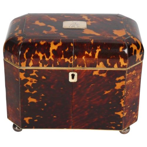 252 - An early 19th century tortoiseshell and silver inlaid tea caddy, with silver crest inset to the lid,... 