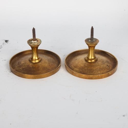 253 - A pair of Victorian cast and chased gilded brass curtain tidies, diameter 9.5cm