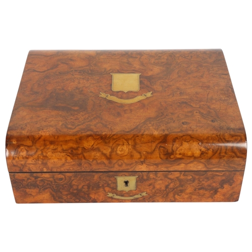 255 - A good quality Victorian walnut dome-top travelling box, with inlaid brass shields, the interior of ... 