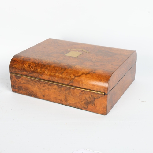 255 - A good quality Victorian walnut dome-top travelling box, with inlaid brass shields, the interior of ... 