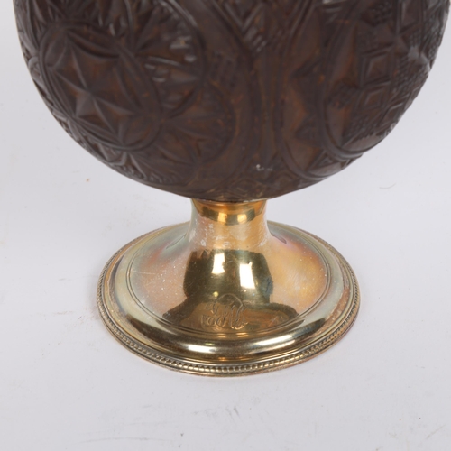 30 - A George III silver-mounted coconut cup, allover geometric chip cut decoration, by Thomas Daniell, h... 