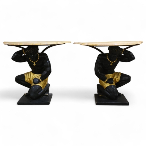 4 - An impressive pair of Blackamoor console tables, shaped and moulded coloured marble tops, supported ... 