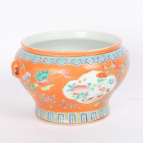 71 - A Chinese peach ground porcelain bowl, with painted enamel panels, overall diameter 19cm, height 12c... 