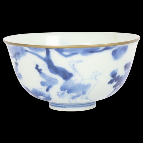 72 - A Chinese blue and white porcelain bowl with metal rim and 2 character mark, diameter 11cm