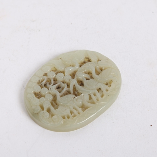 84 - A Chinese relief carved and pierced jade pendant, stork design, Qing Dynasty, 6.5cm x 5.5cm