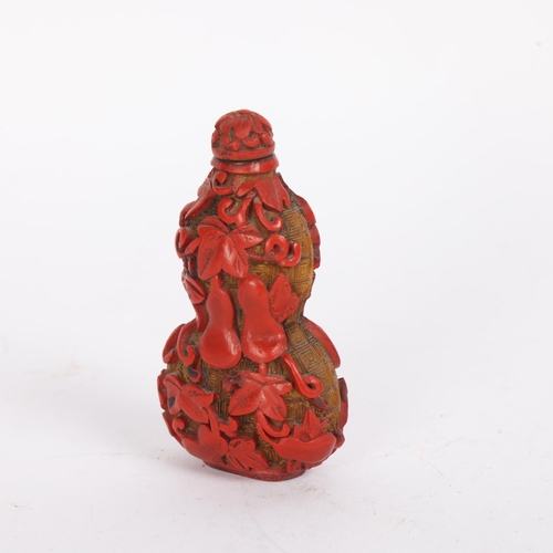 85 - A Chinese relief carved cinnabar double-gourd snuff bottle and stopper, Qing Dynasty, height 8.5cm