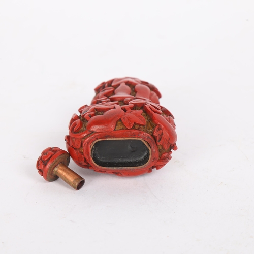 85 - A Chinese relief carved cinnabar double-gourd snuff bottle and stopper, Qing Dynasty, height 8.5cm