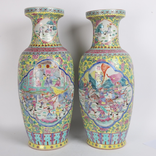 87 - A pair of Chinese famille jeaune porcelain vases, with enamel decorated panels, height 59cm