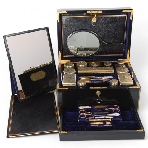 9 - An exceptionally fine and complete Victorian travelling dressing case by F West, Manufacturer to Her... 