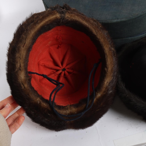 39A - 2 Chinese fur-trimmed winter court hats, in an original blue fabric-covered silk-lined hat box