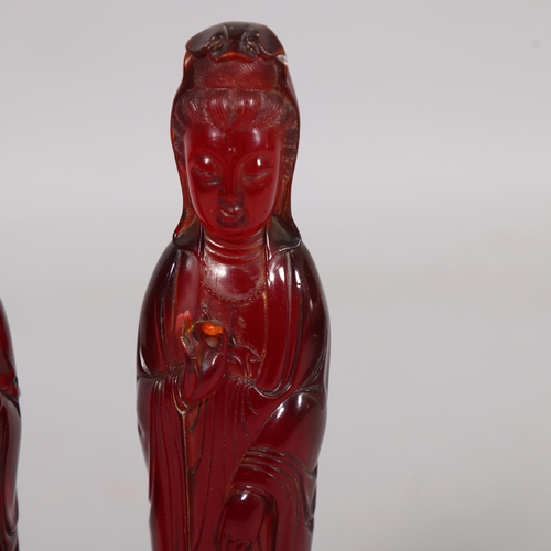 42 - 2 similar Chinese amber figures on carved wood bases, height 32cm