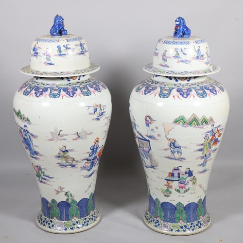 44 - A massive pair of Chinese white glaze porcelain jars and covers, with hand painted figures and dog o... 