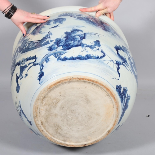 46 - A large Chinese blue and white porcelain fish bowl, decorated with boats among the reeds, diameter 5... 