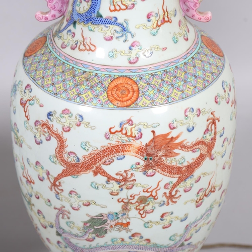 48 - A pair of Chinese famille rose porcelain lamps, with enamel dragon decoration and gilt-metal mounts,... 