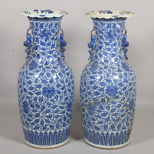 54 - A large pair of Chinese blue and white porcelain jars, with dragon handles, height 82cm, 1 A/F