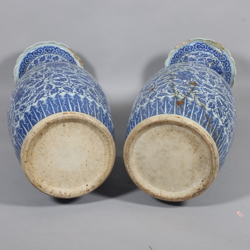 54 - A large pair of Chinese blue and white porcelain jars, with dragon handles, height 82cm, 1 A/F