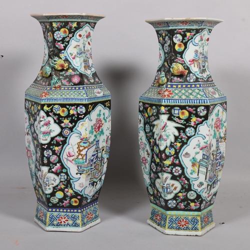 55 - A pair of Chinese porcelain vases, bulbous hexagonal form with pomegranate handles and enamelled dec... 