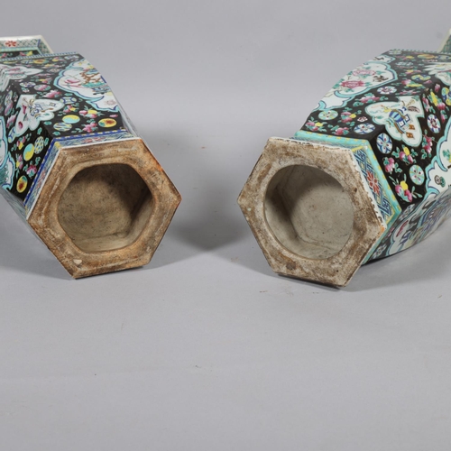 55 - A pair of Chinese porcelain vases, bulbous hexagonal form with pomegranate handles and enamelled dec... 