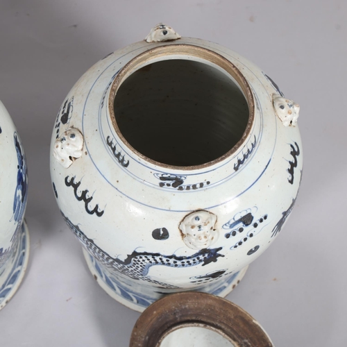 61 - A pair of Chinese blue and white jars and covers, with dragon decoration, height 55cm