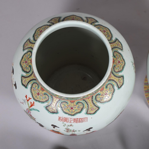 63 - A large pair of Chinese porcelain jars and covers, with enamel figures and text, height 61cm