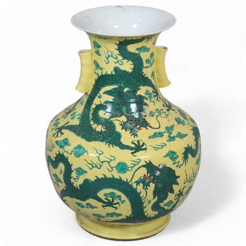 64 - A large Chinese yellow ground porcelain vase, with green enamel dragon decoration, height 56cm