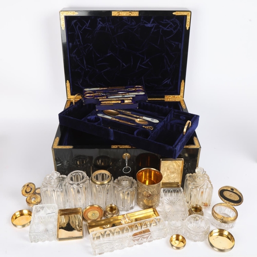 9 - An exceptionally fine and complete Victorian travelling dressing case by F West, Manufacturer to Her... 