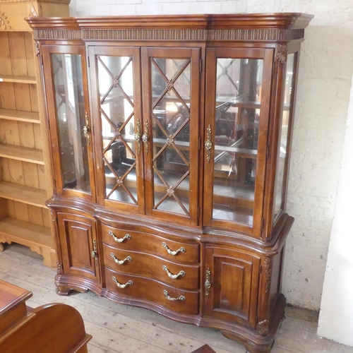 2147 - A modern two-section hardwood display cabinet, with four lattice glazed doors and cupboards under. W... 