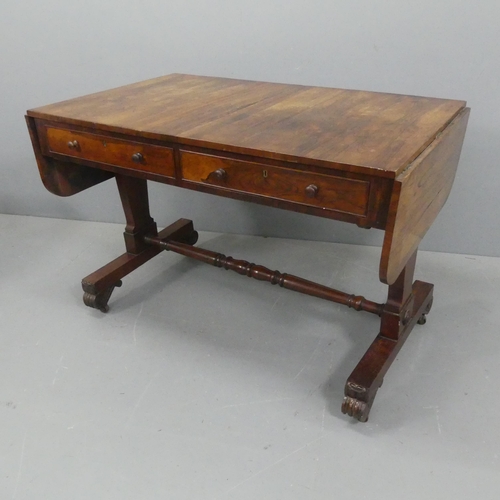 2159 - A Regency rosewood centre-standing sofa table, with two drawers, turned stretcher and carved decorat... 