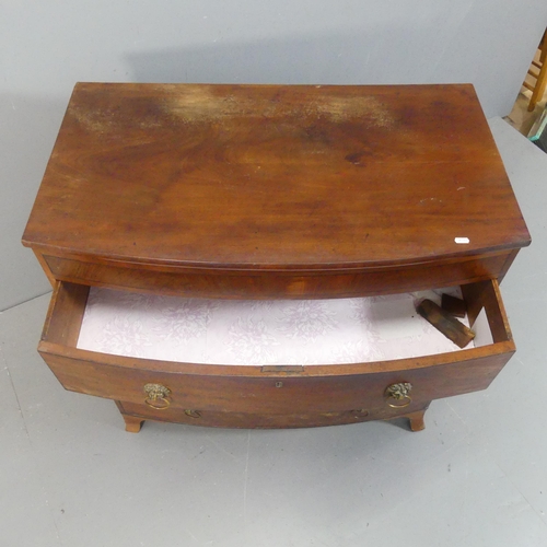 2143 - A Georgian mahogany bow-front chest of three long drawers. Width 95cm, height 92cm, depth 54cm.